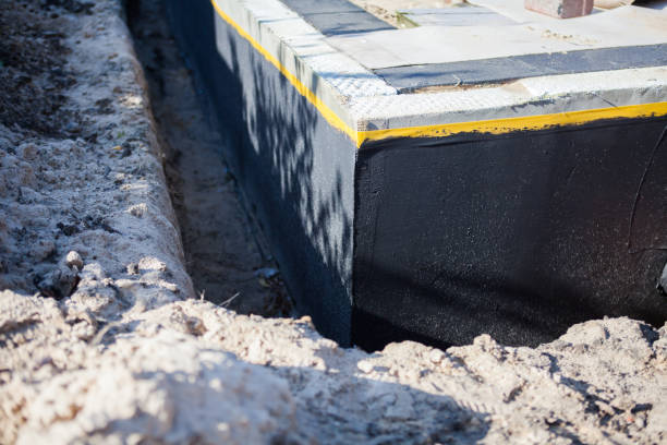 Professional Basement Waterproofing technician working in Lacota, MI